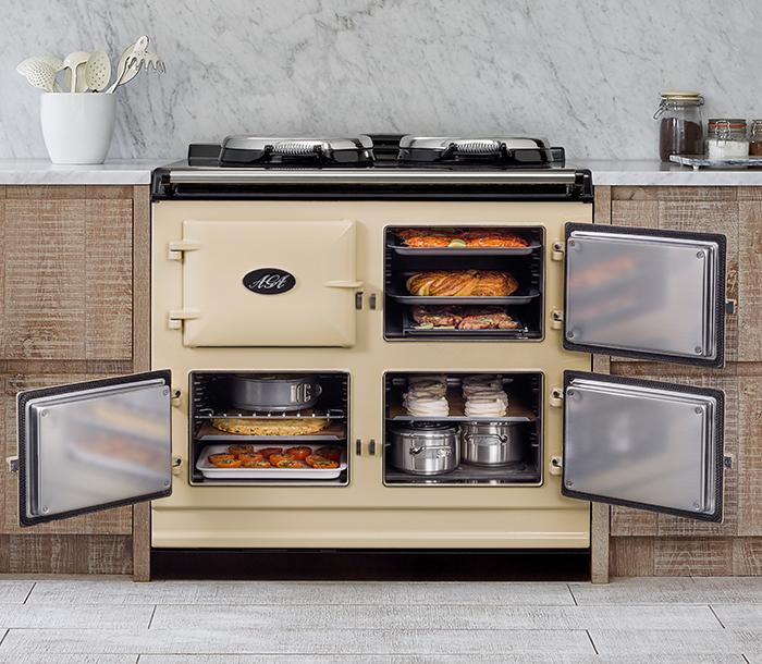 Open AGA filled with baking trays, ceramics and pans