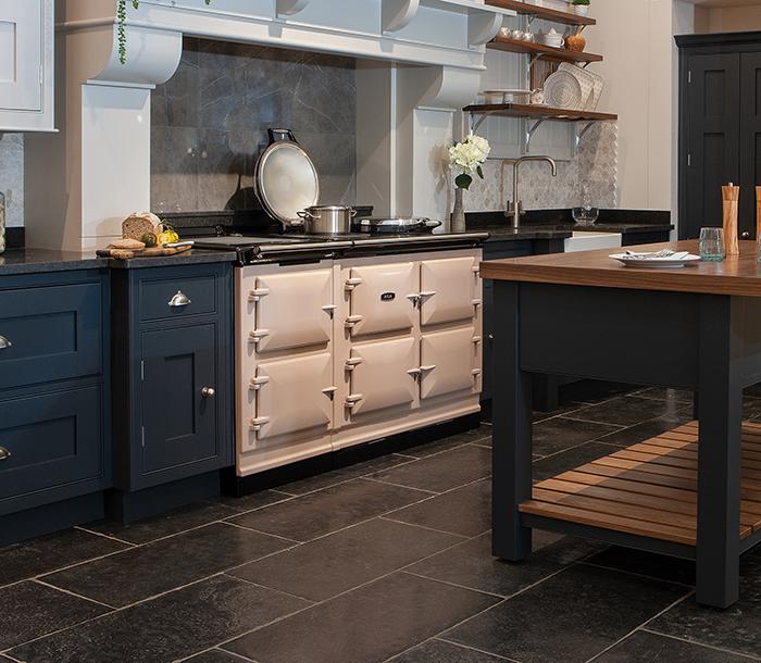 AGA 7 Series 150 cm in blush colour in blue kitchen